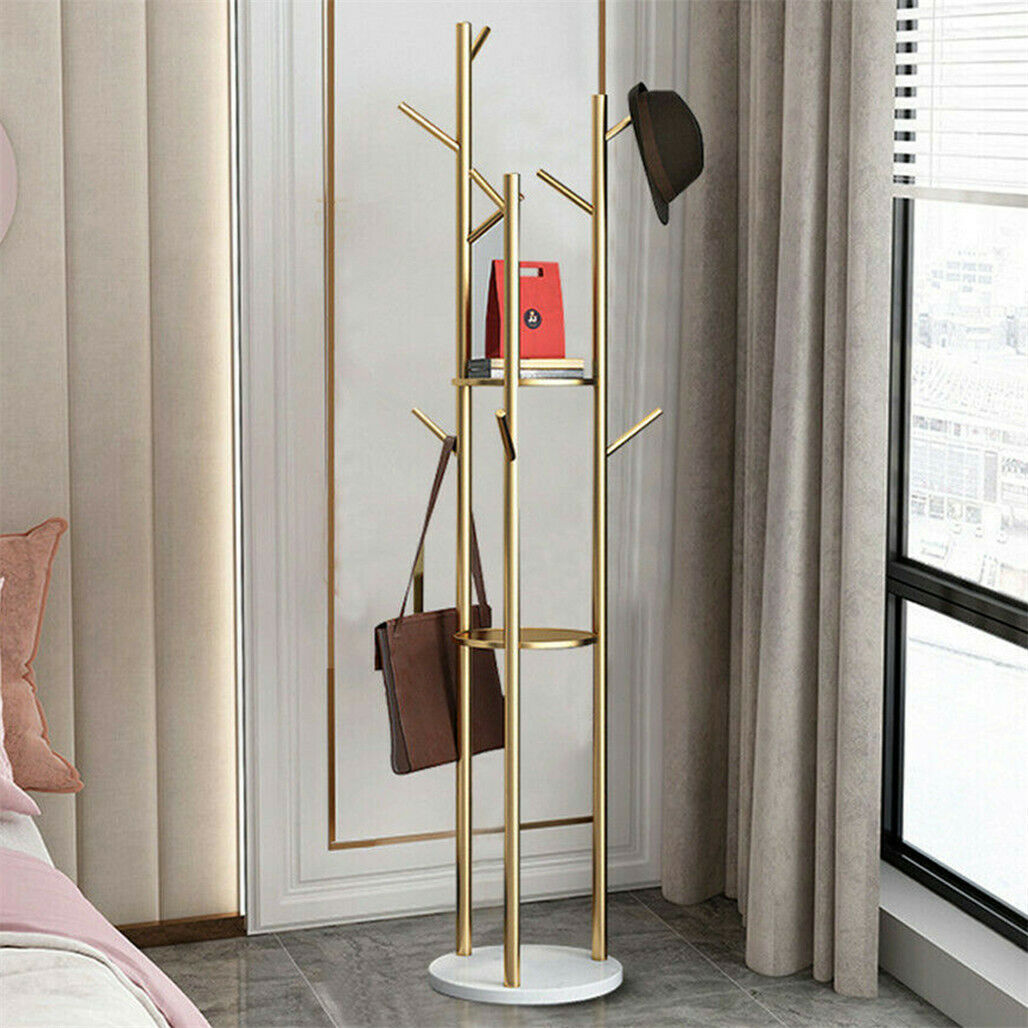 Gold metal coat rack with marble base