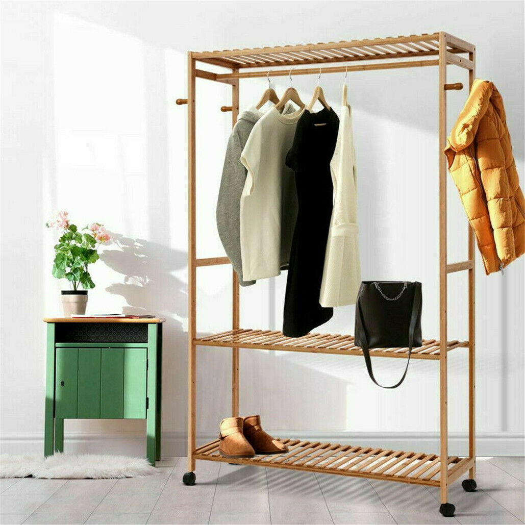 Bamboo clothes rack styled with garments and accessories