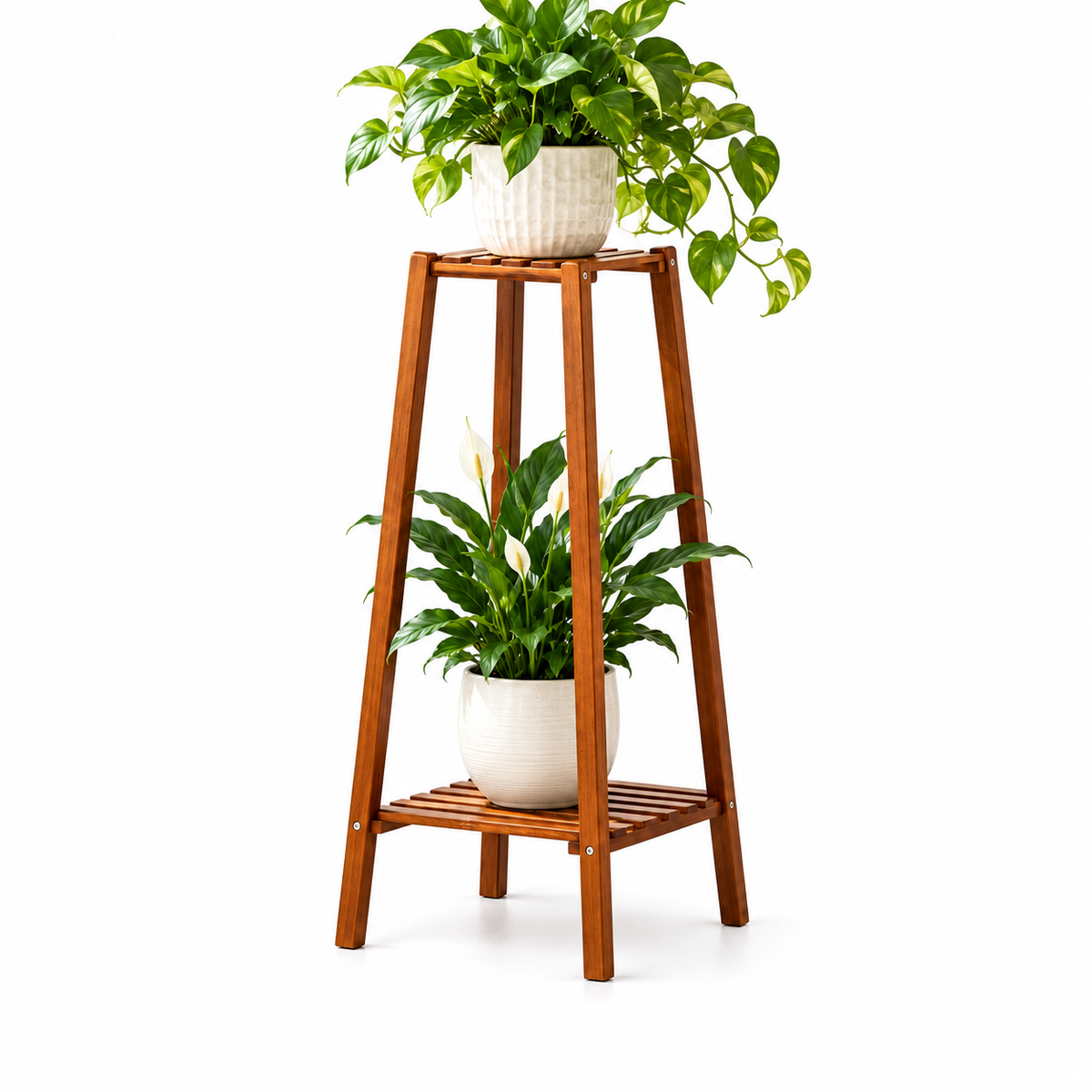 2-tier bamboo plant stand in brown holding a potted pothos on top and a peace lily on the bottom shelf
