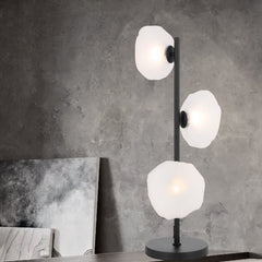 Stylish Calais table lamp with black frame and three frost glass lights