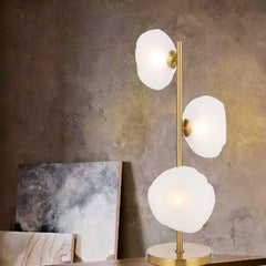 Elegant three-light table lamp with antique gold frame and frost glass