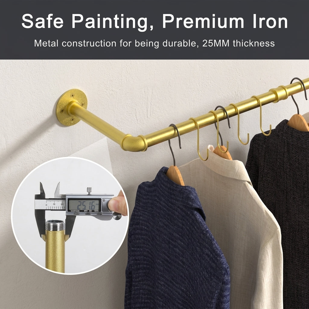 Gold wall mounted pipe clothes rail with gold S-hooks and hangers holding sweaters and shirts, with a pipe diameter close-up