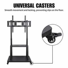 Close up of a locking caster on the base of a black mobile TV stand beside the full stand