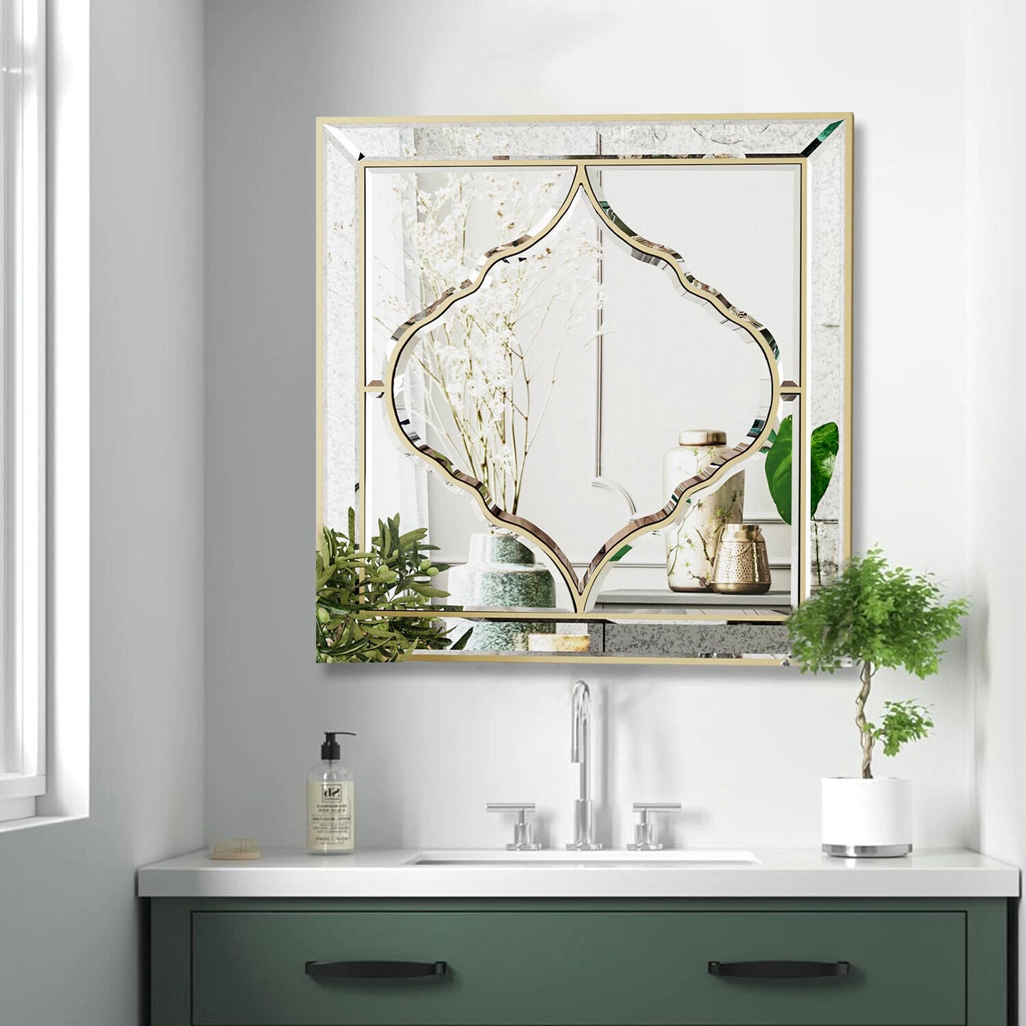 Square wall mirror with golden edge, close-up detail