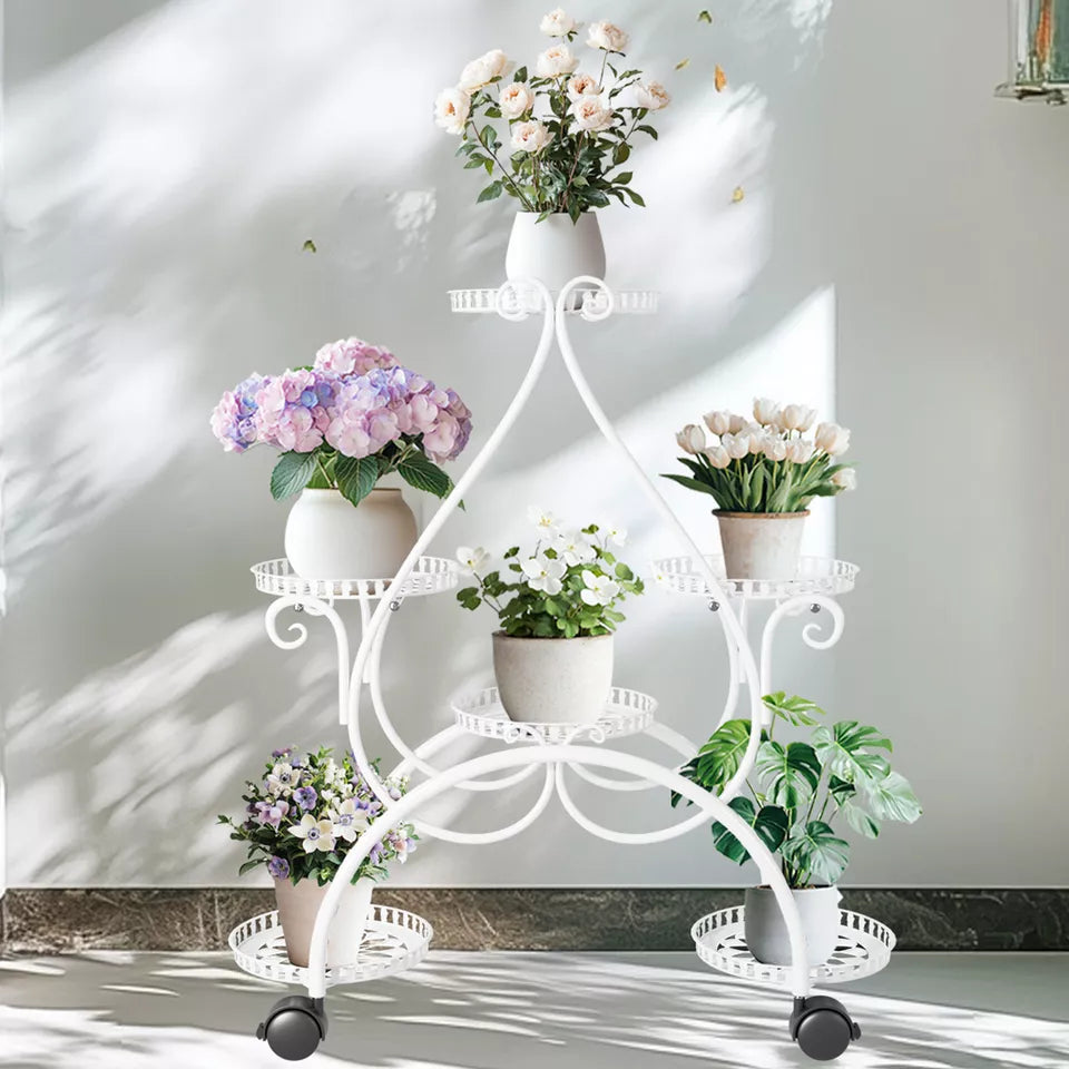 Wheeled white plant stand shown with six pots